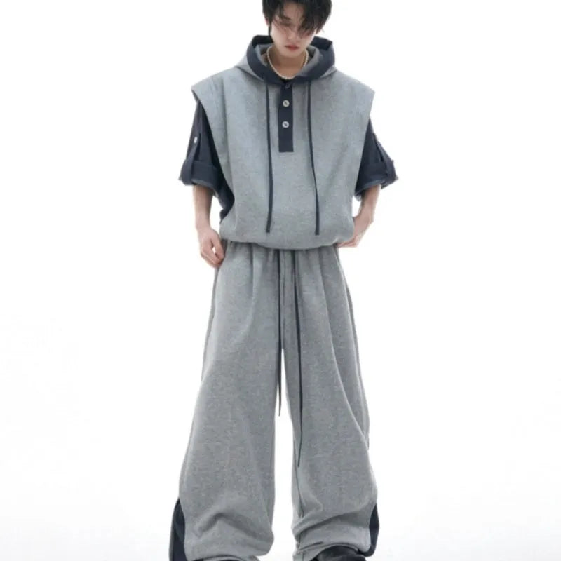 Men's black and grey polyester tracksuit with hooded jacket featuring three-dimensional stitching design
