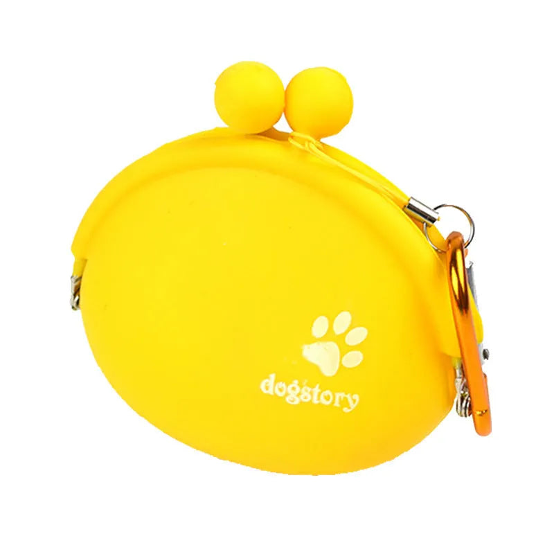 Yellow silicone dog treat pouch with hook and loop strap, shown on a waistband.