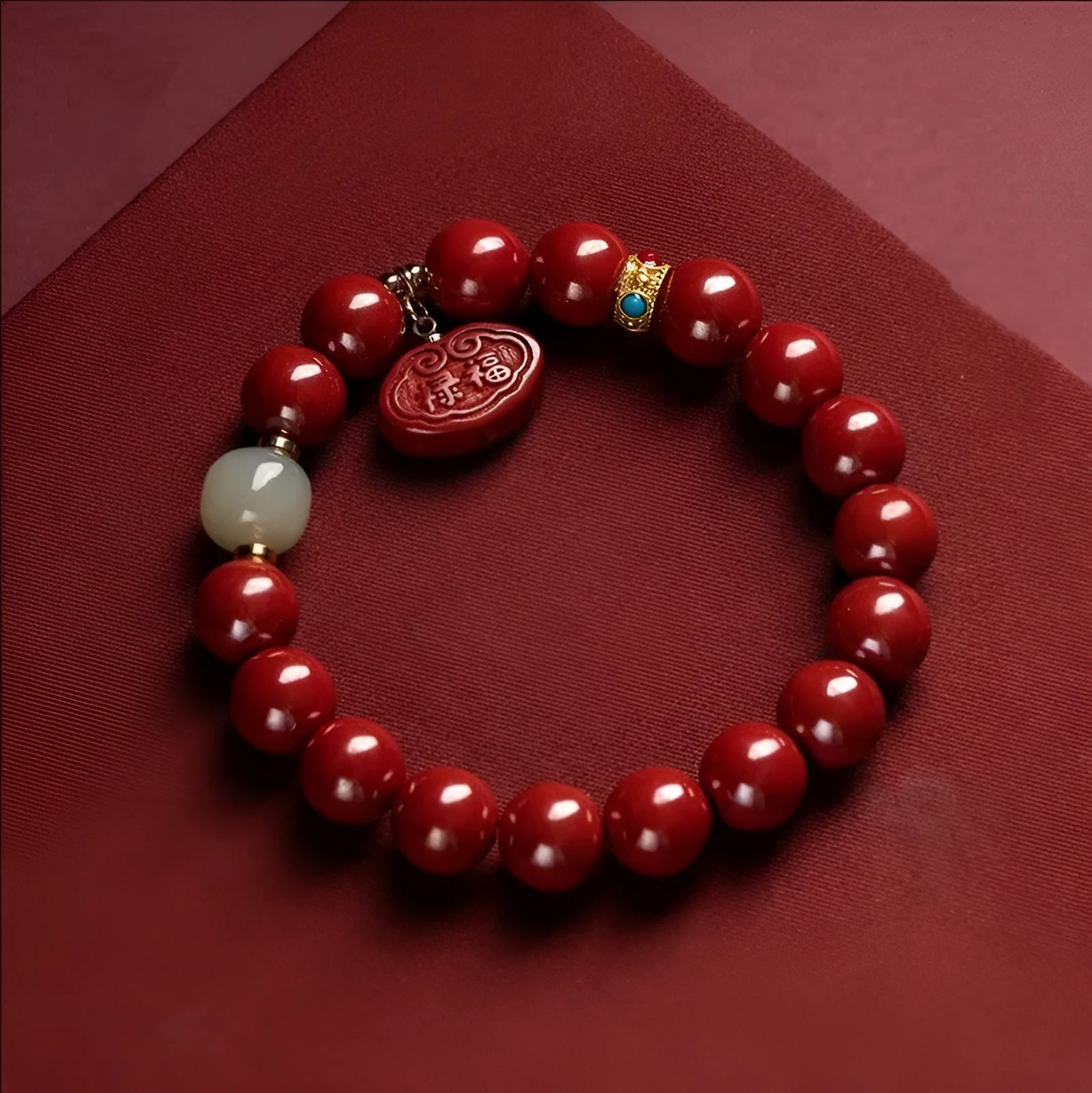 Natural cinnabar bracelet with Ping An Fu Lu design on 8mm or 10mm beads.