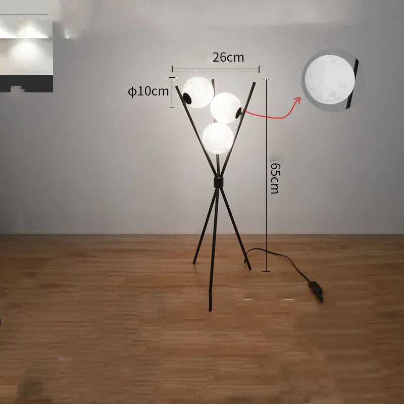 Scandinavian LED table lamp with iron body and acrylic shade on a white table, offering three light colour options