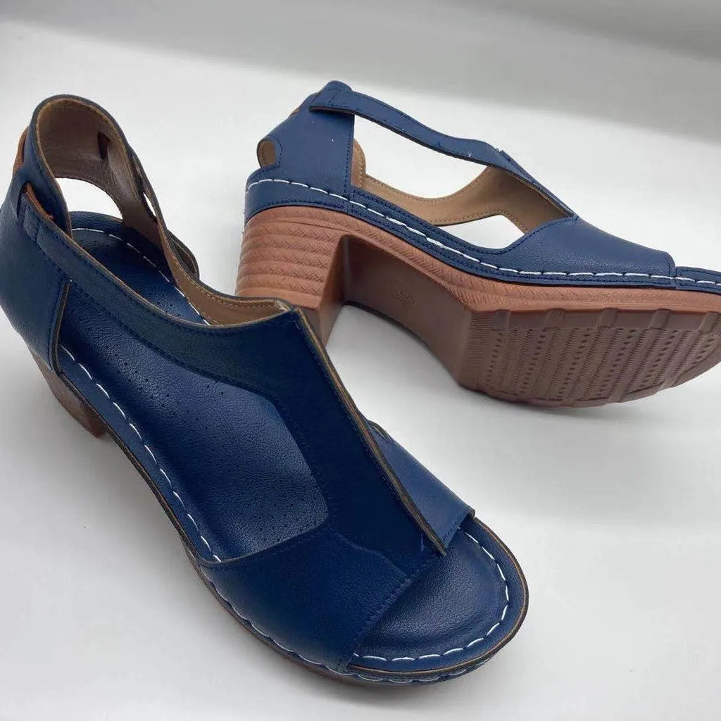 Women's peep toe wedge sandals with buckle detail, low heel, on a white background.