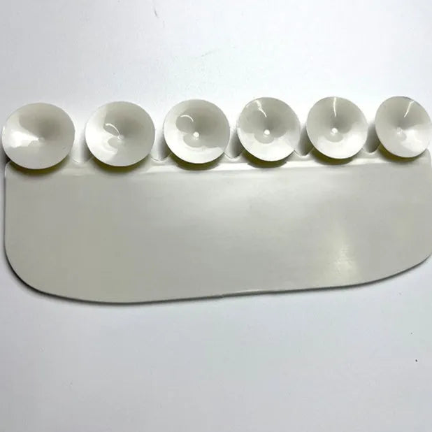 White PVC toilet training splash guard for children placed on toilet seat