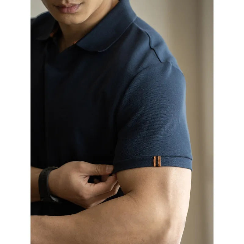American-style short-sleeved polo shirt in blue cotton blend fabric on hanger
