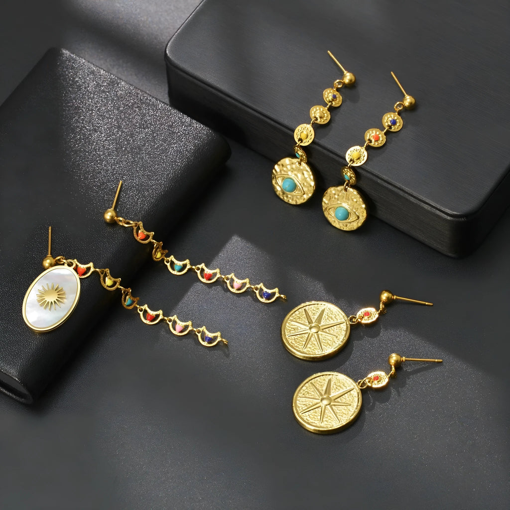 Geometric stainless steel earrings in Eight Awn Star, Eye, and Shell Sun designs
