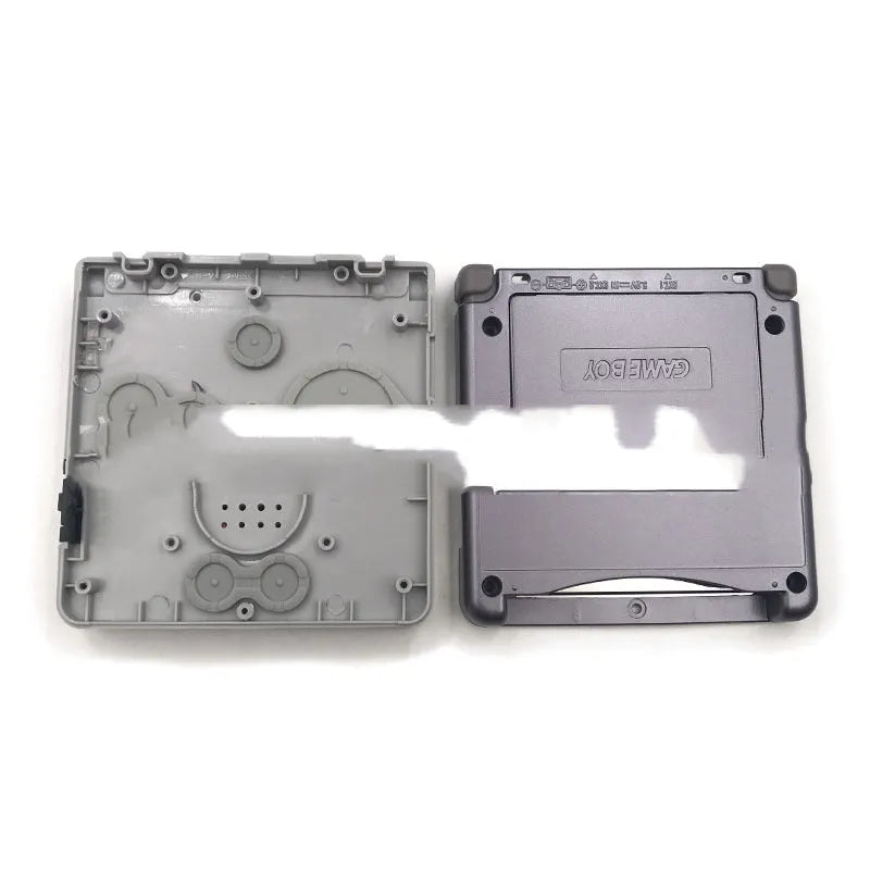Transparent NES style replacement shell for Nintendo Game Boy Advance SP console showing grey colour and internal circuit board visible
