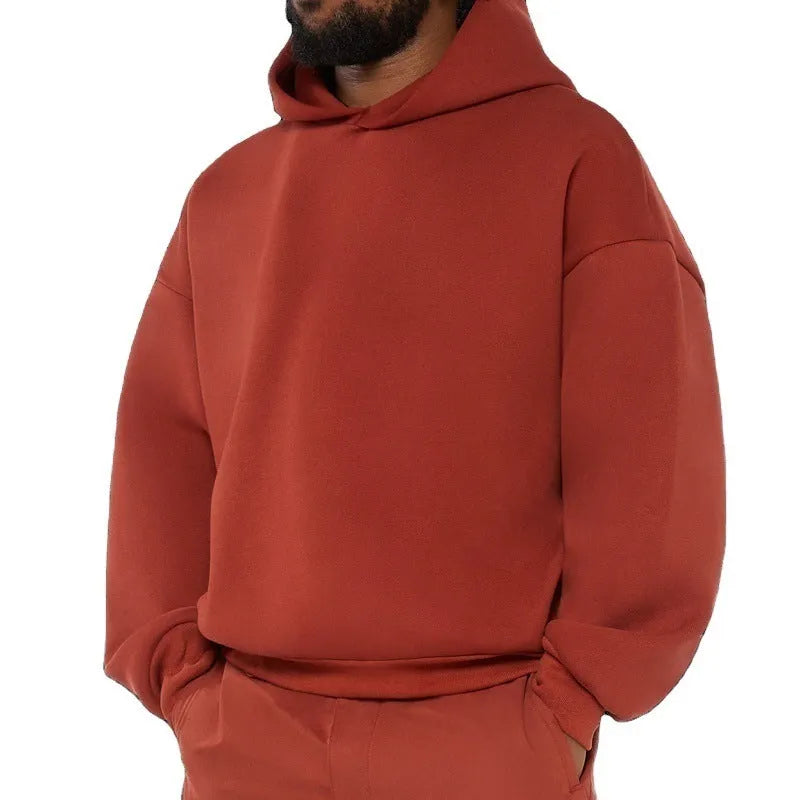 Man wearing a solid colour fleece-lined cotton hoodie sweater with a wool lining.