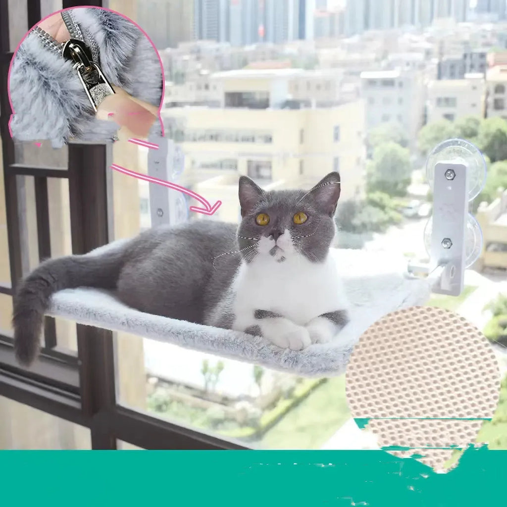 Cat resting on a suction cup window hammock made of plush fabric and steel in beige colour