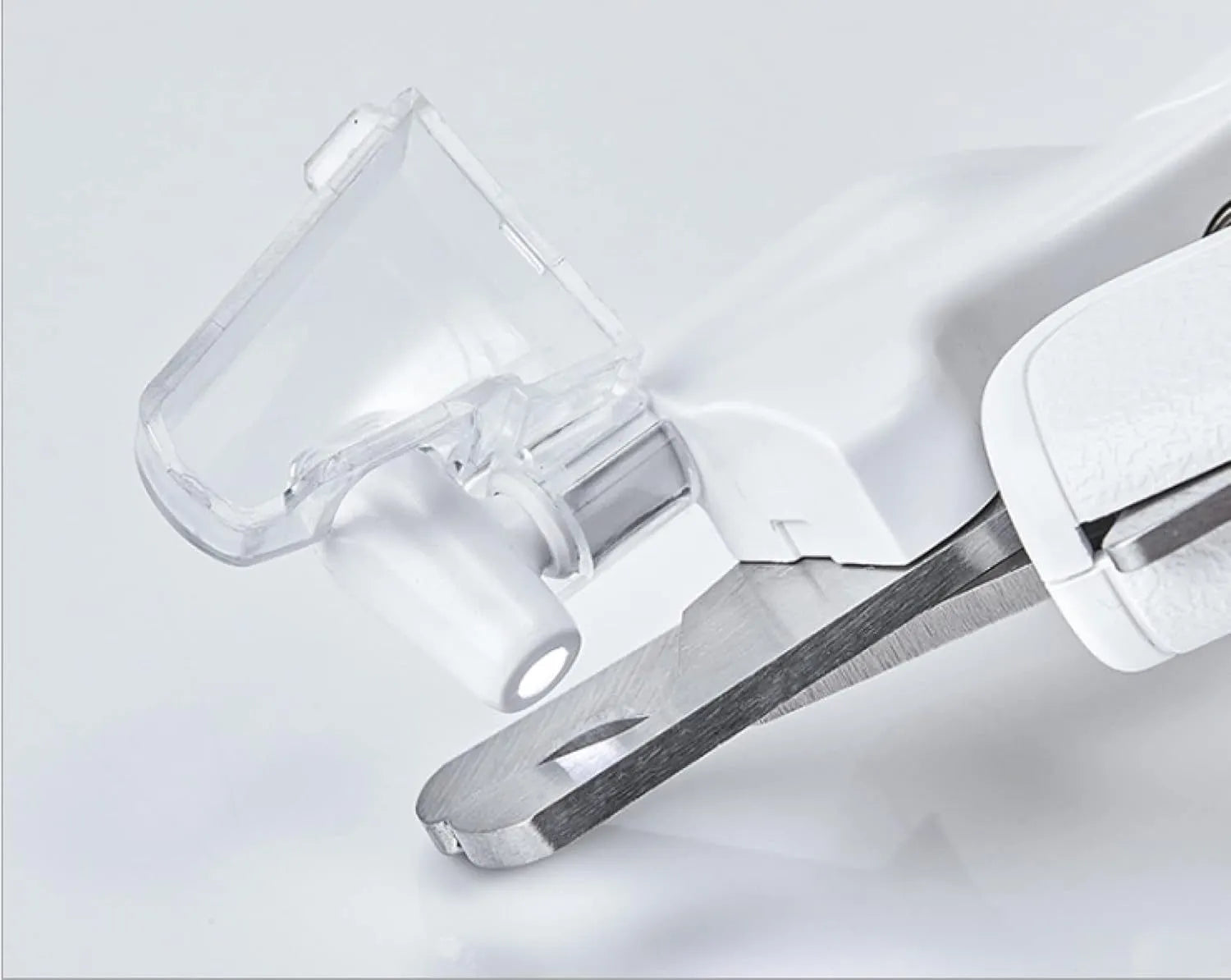 White pet nail clippers with LED light and transparent anti-splash guard for cats and dogs