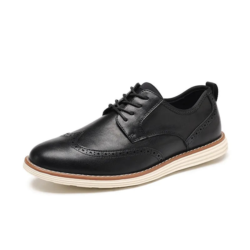 Men's black slip-on business casual shoe with round toe and carved PU upper detail on a white background.