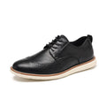 Men's black slip-on business casual shoe with round toe and carved PU upper detail on a white background.