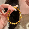 Natural yellow tiger's eye Hetian jade bracelet with U-shaped design and diamond treatment
