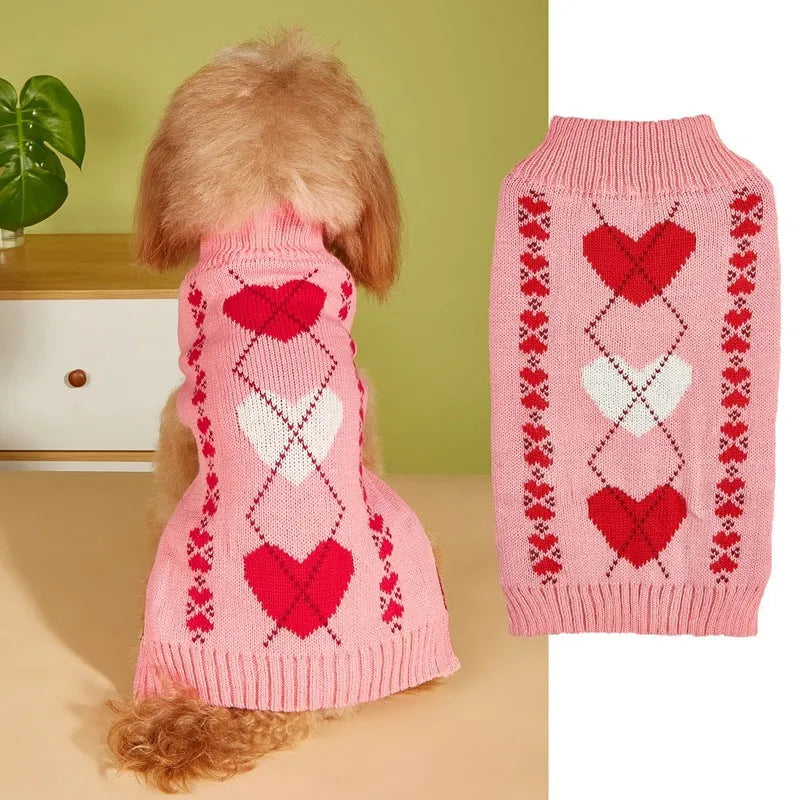 Red dog sweater with a white love heart and bow design on a small dog.