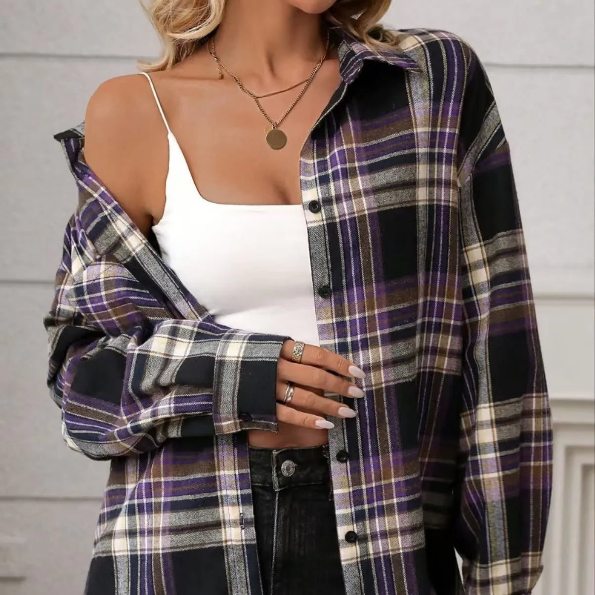 Women's loose-fit retro plaid cotton shirt in black, shown on a hanger