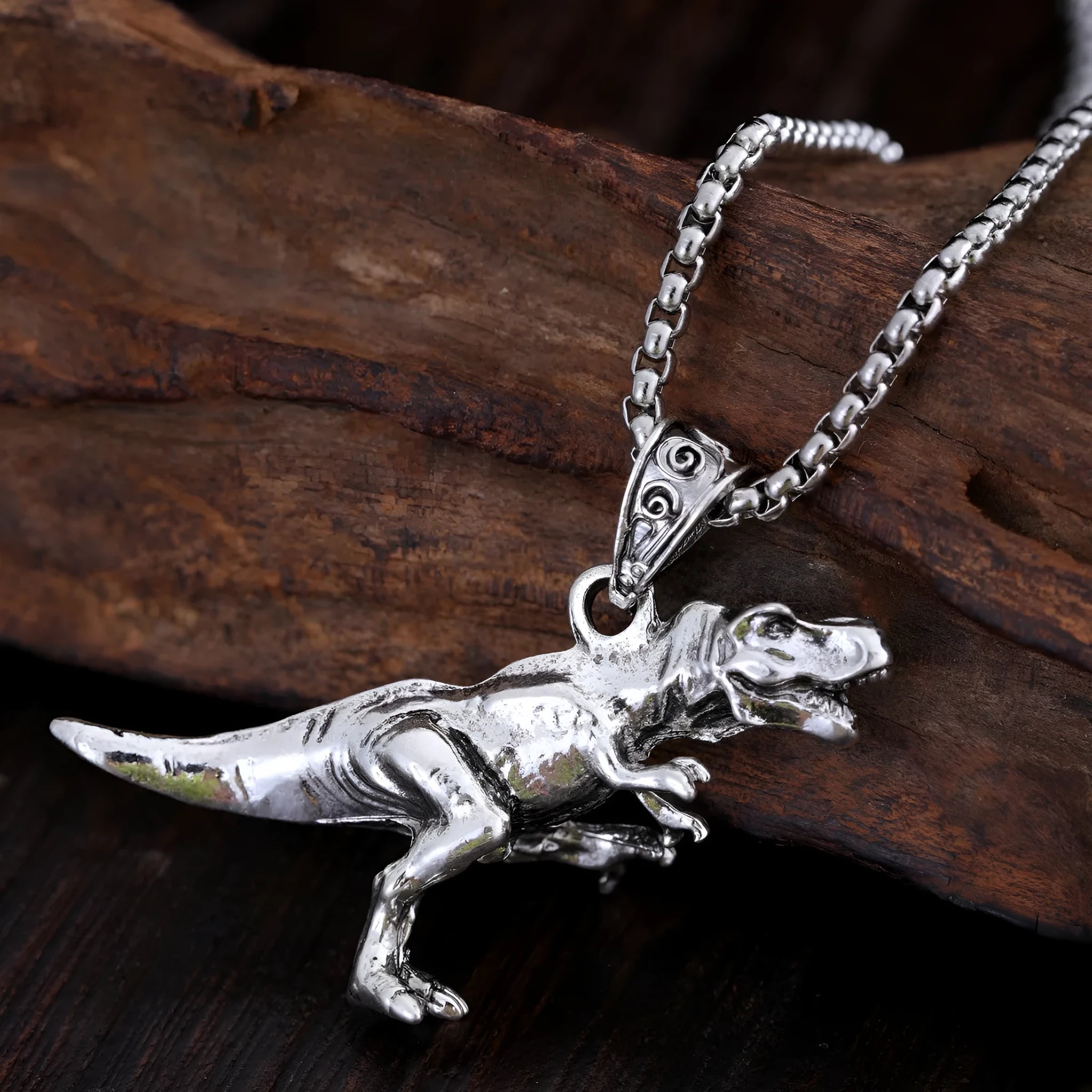 New hip hop style versatile titanium dinosaur pendant in silver tone on a neutral background