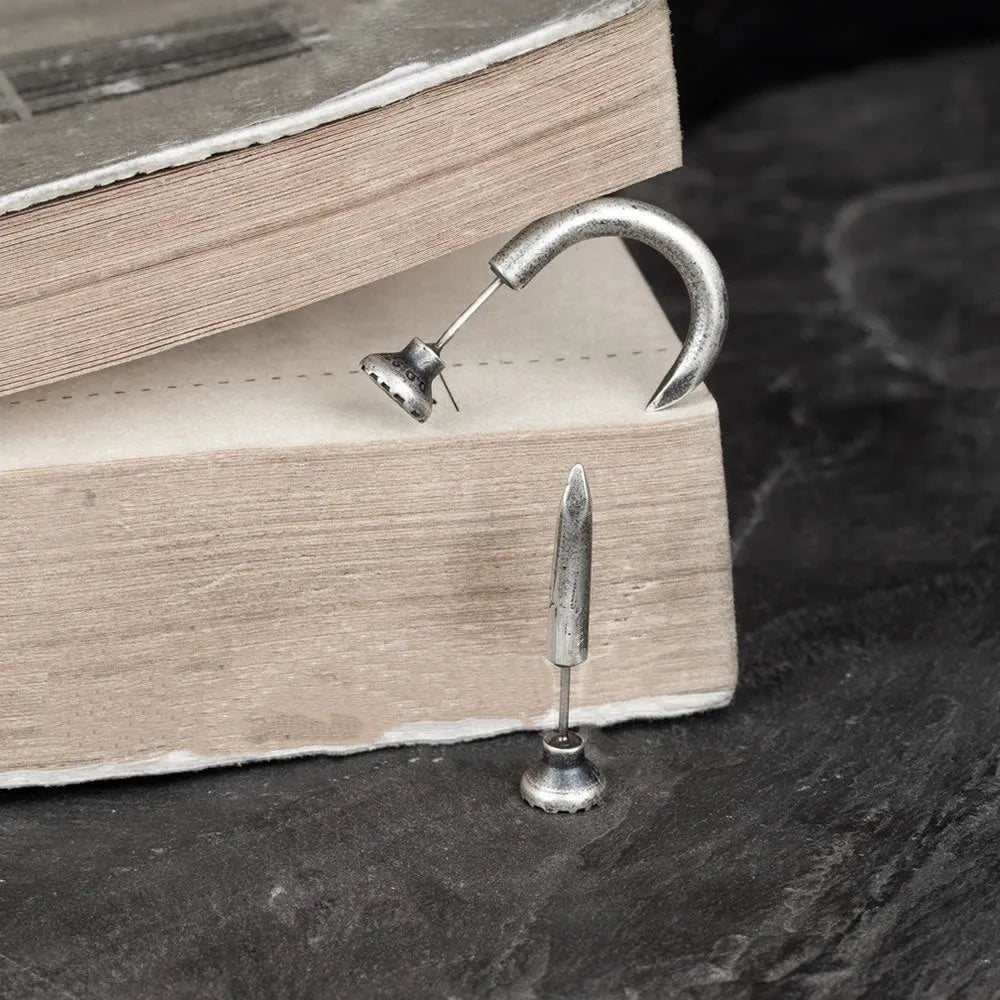 Sterling silver nail stud earrings in straight and curved punk designs