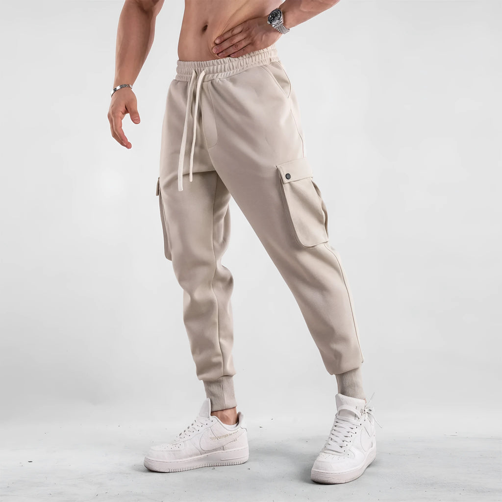Men's cotton sports trousers with ankle ties and multiple pockets in apricot colour