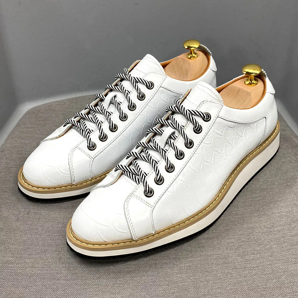 Men's low-top handmade casual shoes with an embossed pattern and front lace closure.