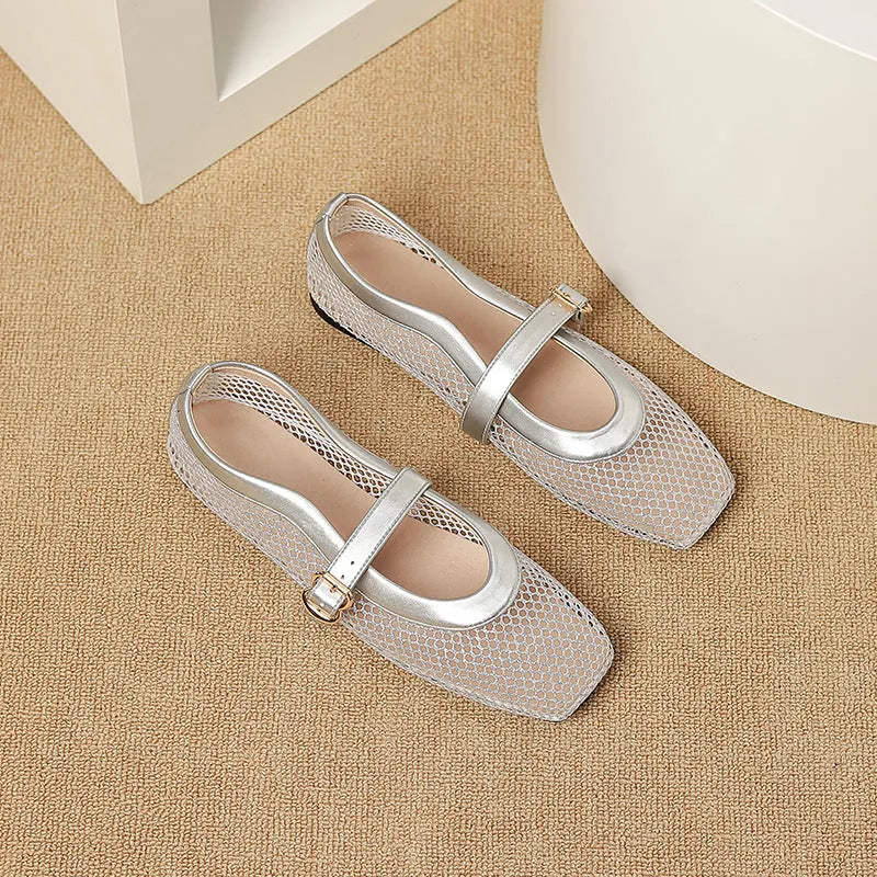 Women's beige mesh low heel pump with a buckle strap and square toe on a neutral background.