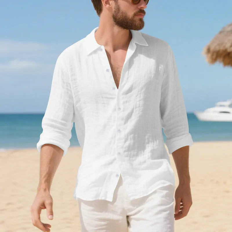 Men's loose fit linen Hawaiian casual shirt on a hanger, shown in light blue colour.