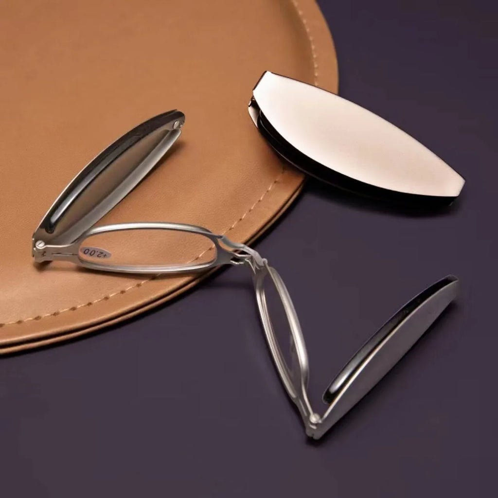 Folding presbyopic glasses with retro ring detailing on black or silver anti-fall frames