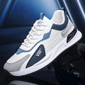 Men's colour block mesh sneakers in black, grey, and white with round toe and flat heel.