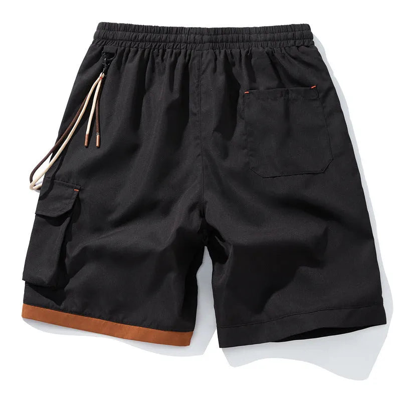 Man wearing coffee-coloured loose-fit bamboo fibre sports shorts with a straight leg and cropped length.