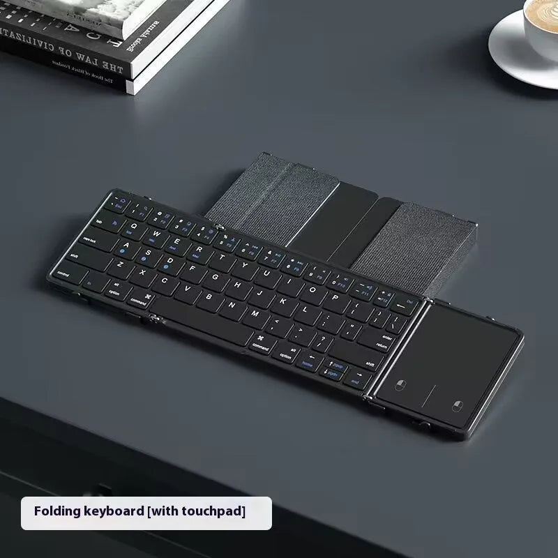 Black folding Bluetooth keyboard with touchpad option showing compact folded size