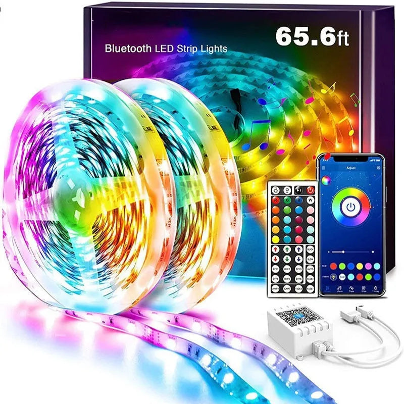Roll of flexible RGB LED strip light with Bluetooth controller and power adapter on a table