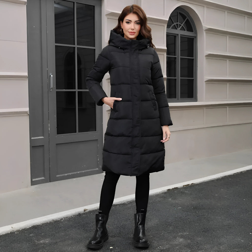 Black slim-fit hooded long cotton jacket for men on a hanger.