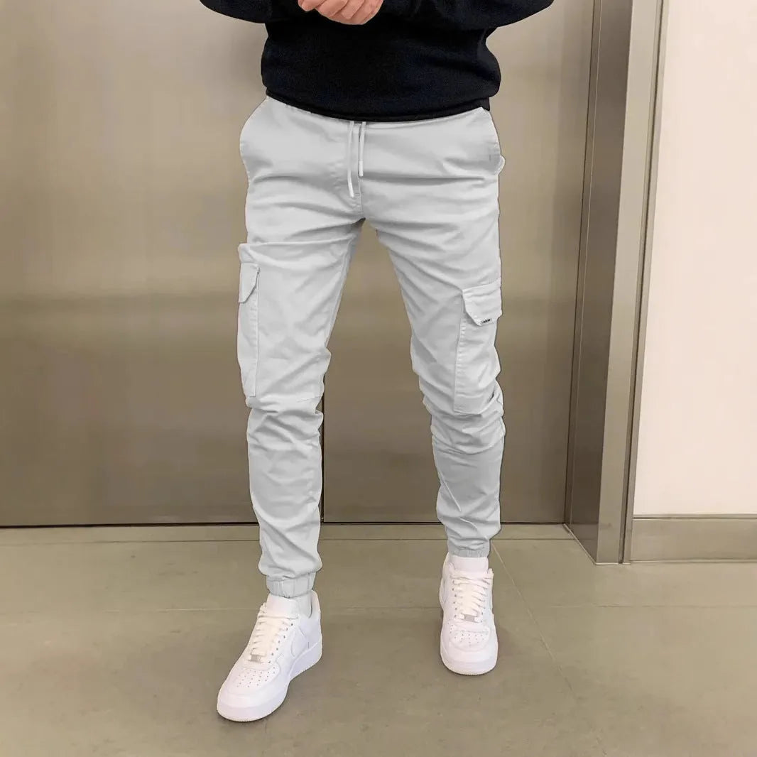 Men's light blue polyester baggy trousers with dimensional patch pockets and straight leg casual styling