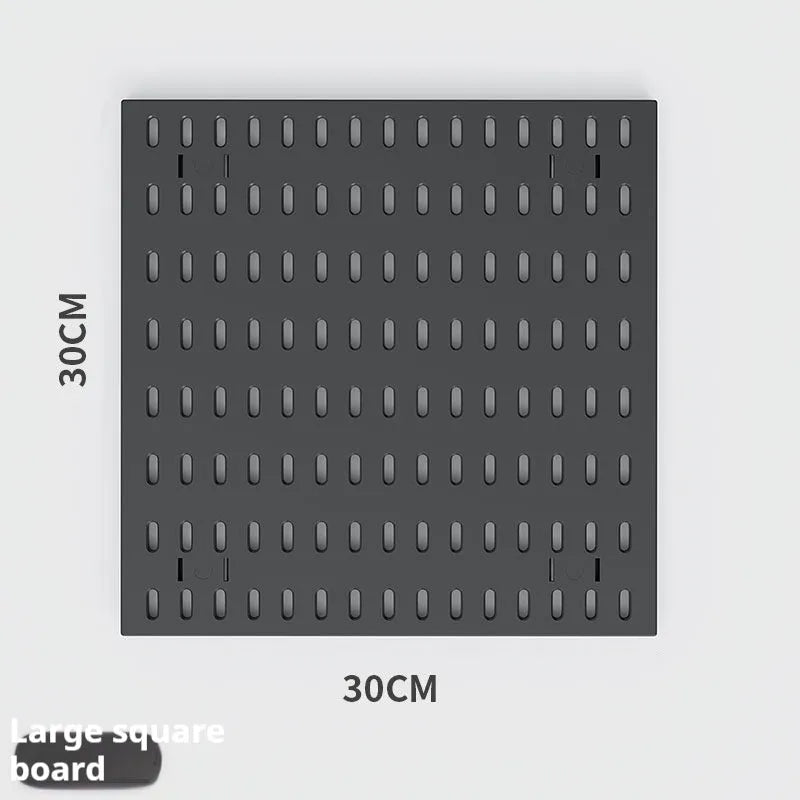 White plastic punch-free wire-wrap board organising cables on wall with modular panel design