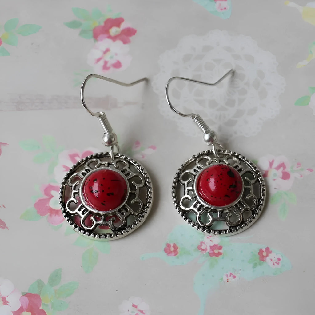 Handmade geometric flower disk earrings in Tibetan silver and turquoise with ethnic Miao design.