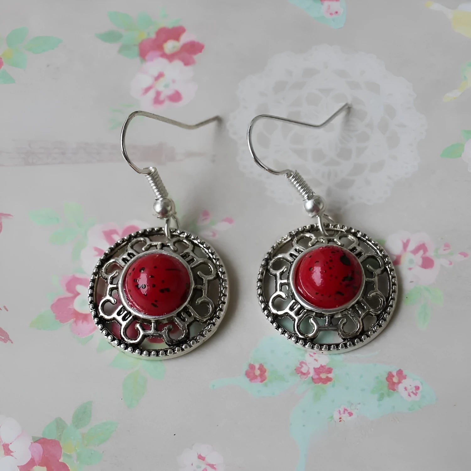 Handmade geometric flower disk earrings in Tibetan silver and turquoise with ethnic Miao design.