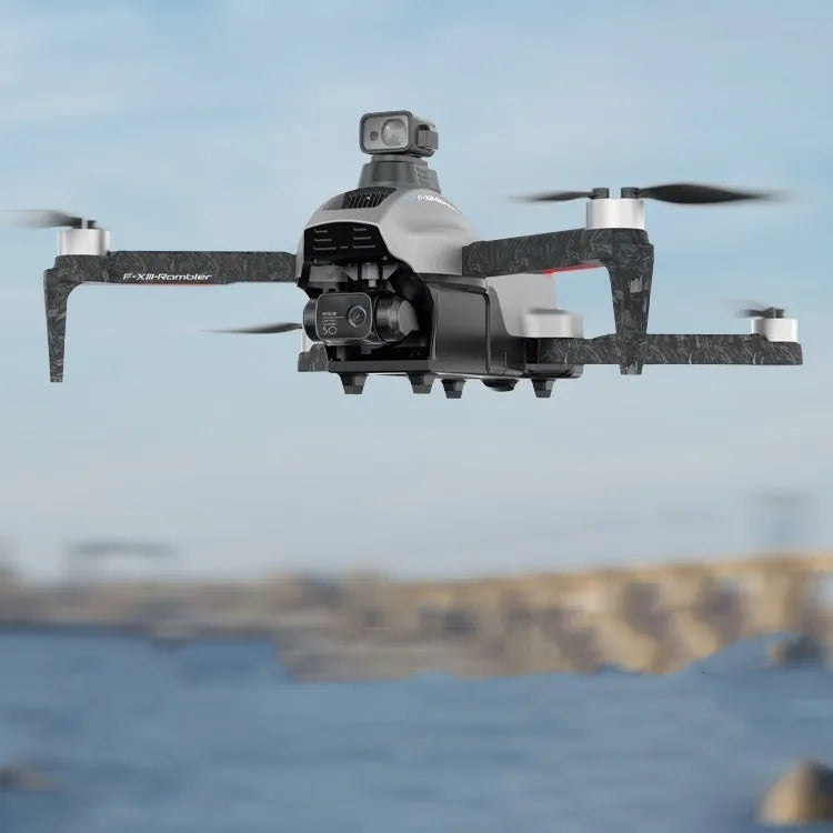 White folding quadcopter drone with camera, remote control, and shoulder bag on a table.
