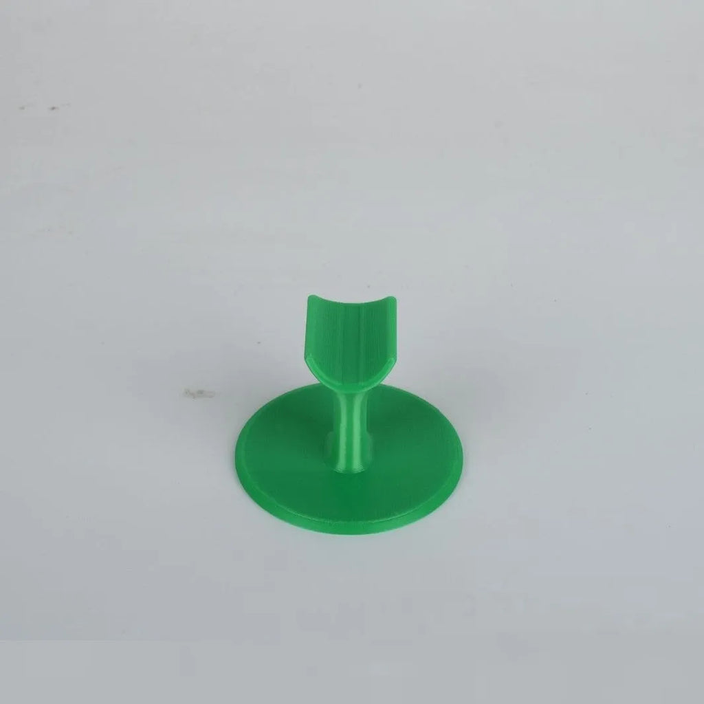 Chinese style resin nail bracket 6x6x4.3 cm on a desk holding nails