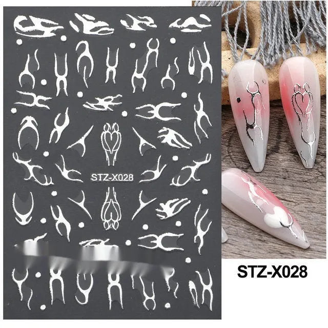 Pack of black and silver striped nail art stickers with cartoon and love pattern designs.