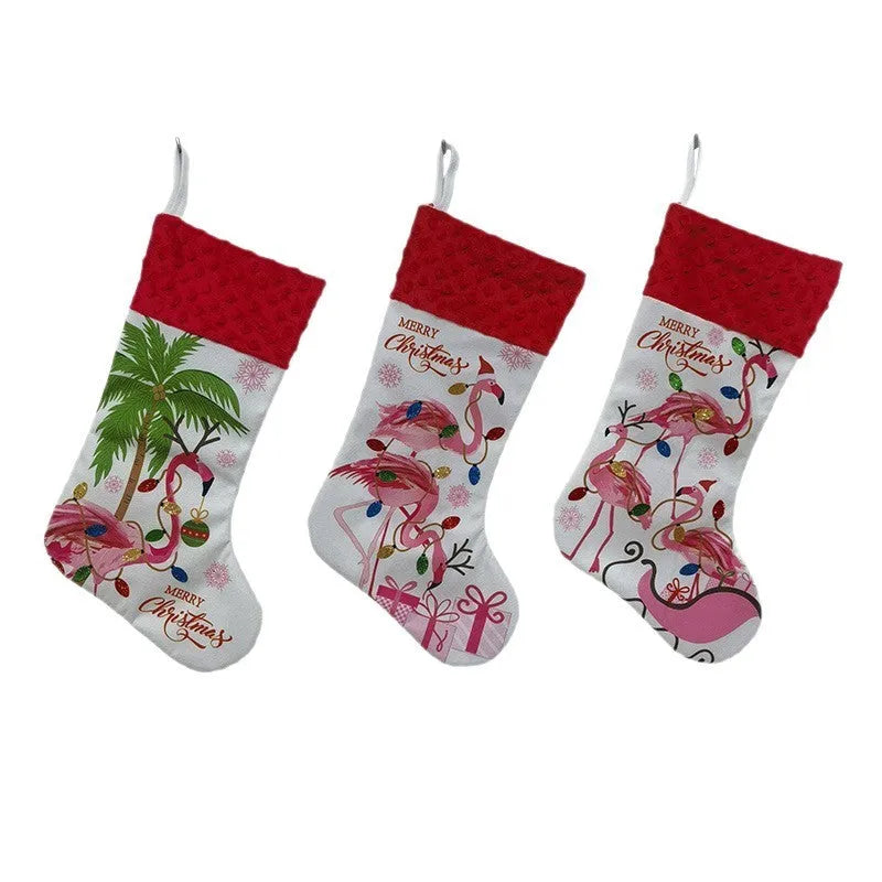 Red cloth flamingo Christmas stocking decoration with white trim, shown hanging.