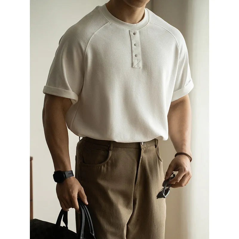 Casual loose top with raglan sleeves in terry texture fabric available in smoky grey, white, and black colours