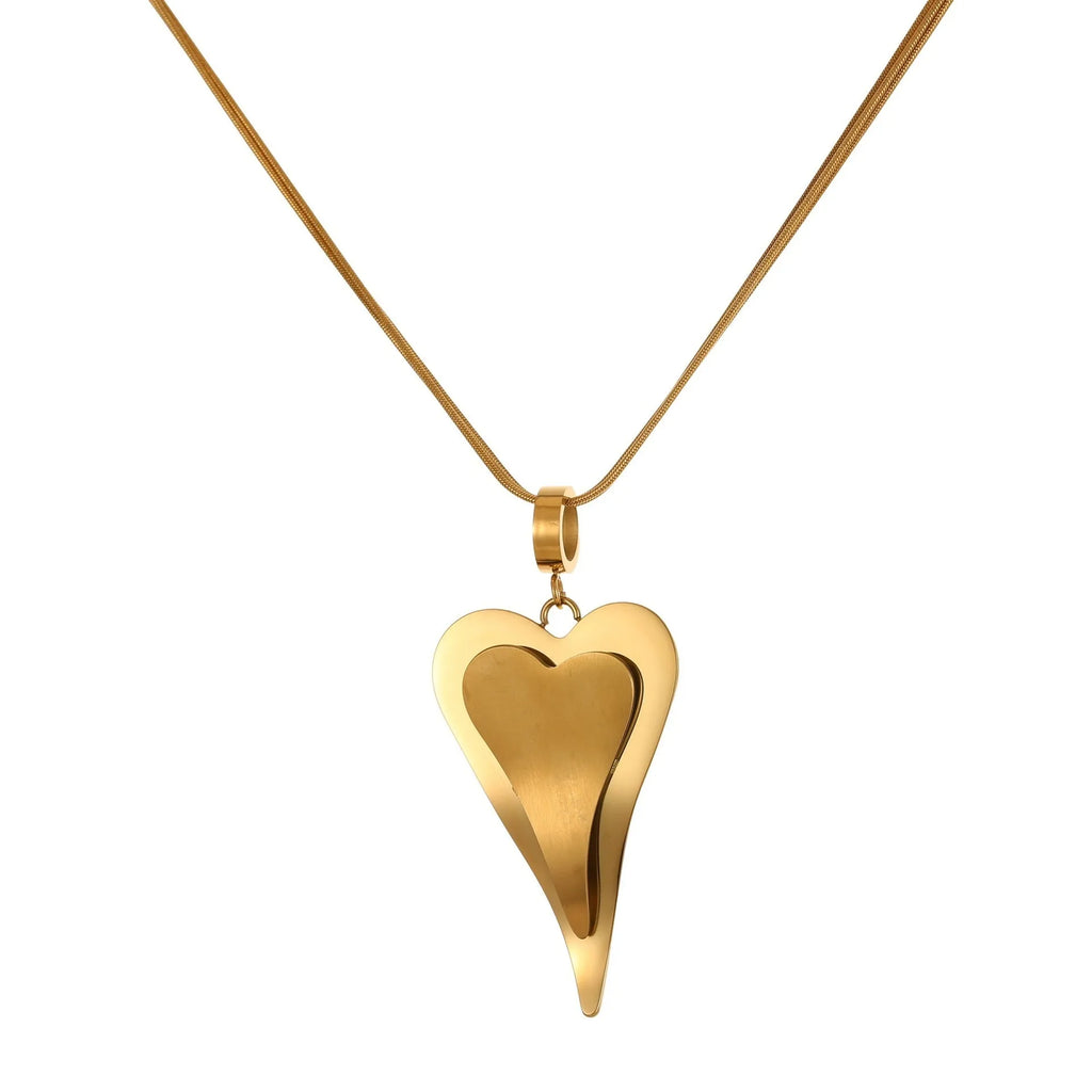 Close-up of a women's stainless steel necklace with a double heart snake bones chain and a geometric pendant.