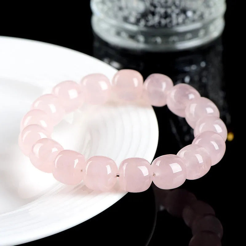 Pink crystal barrel bead bracelet with natural bamboo elements and geometric design