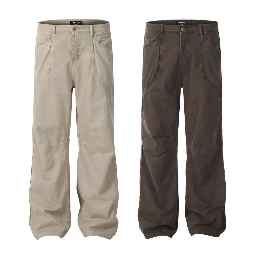 Men's brown loose straight leg trousers with high waist design and zip fly closure