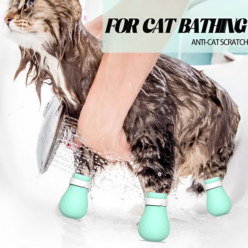 Four green silicone cat paw scratch protection covers with elastic straps