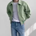 Short jacket with loose lapels in brown suede-style fabric, front view, on a plain background.
