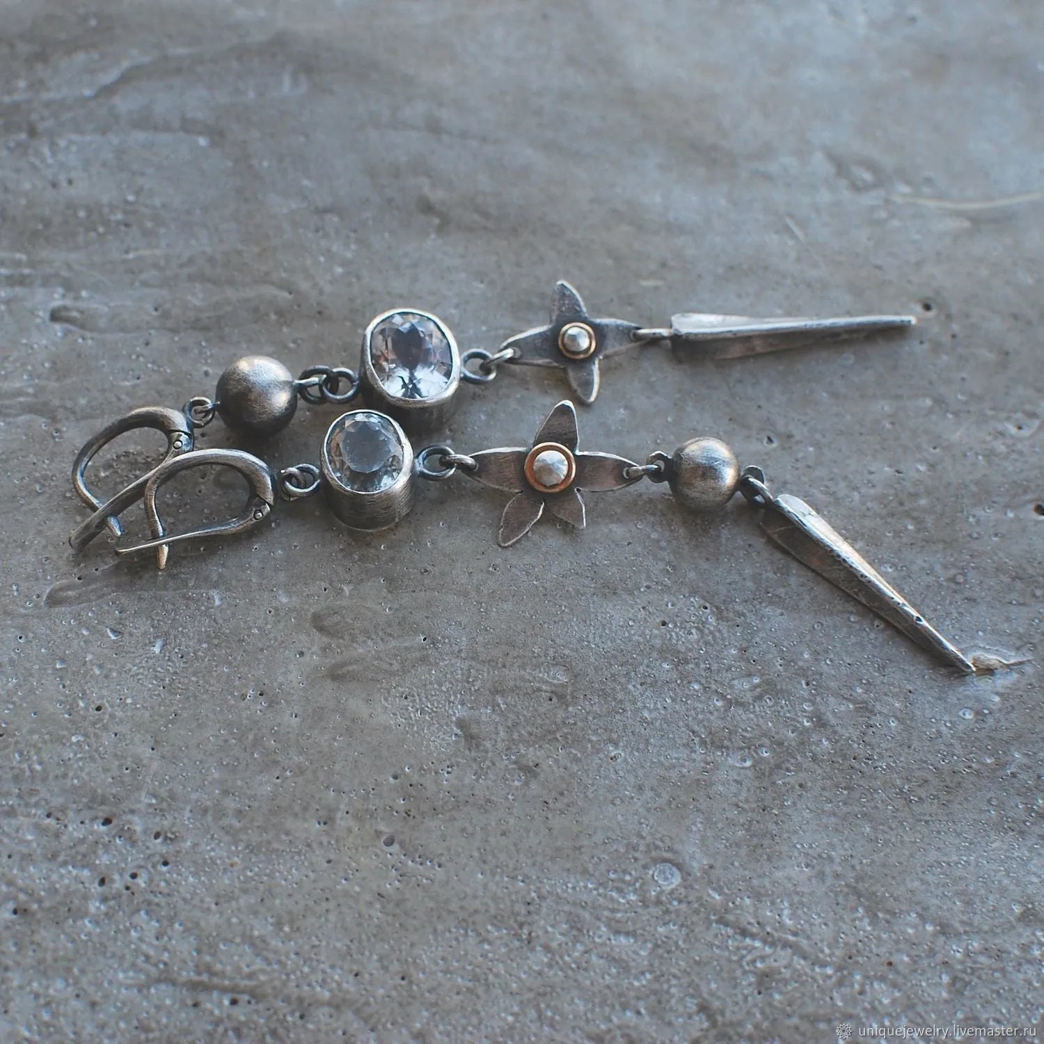 Geometric antique silver pendant earrings with XINGX design and rhinestone accents