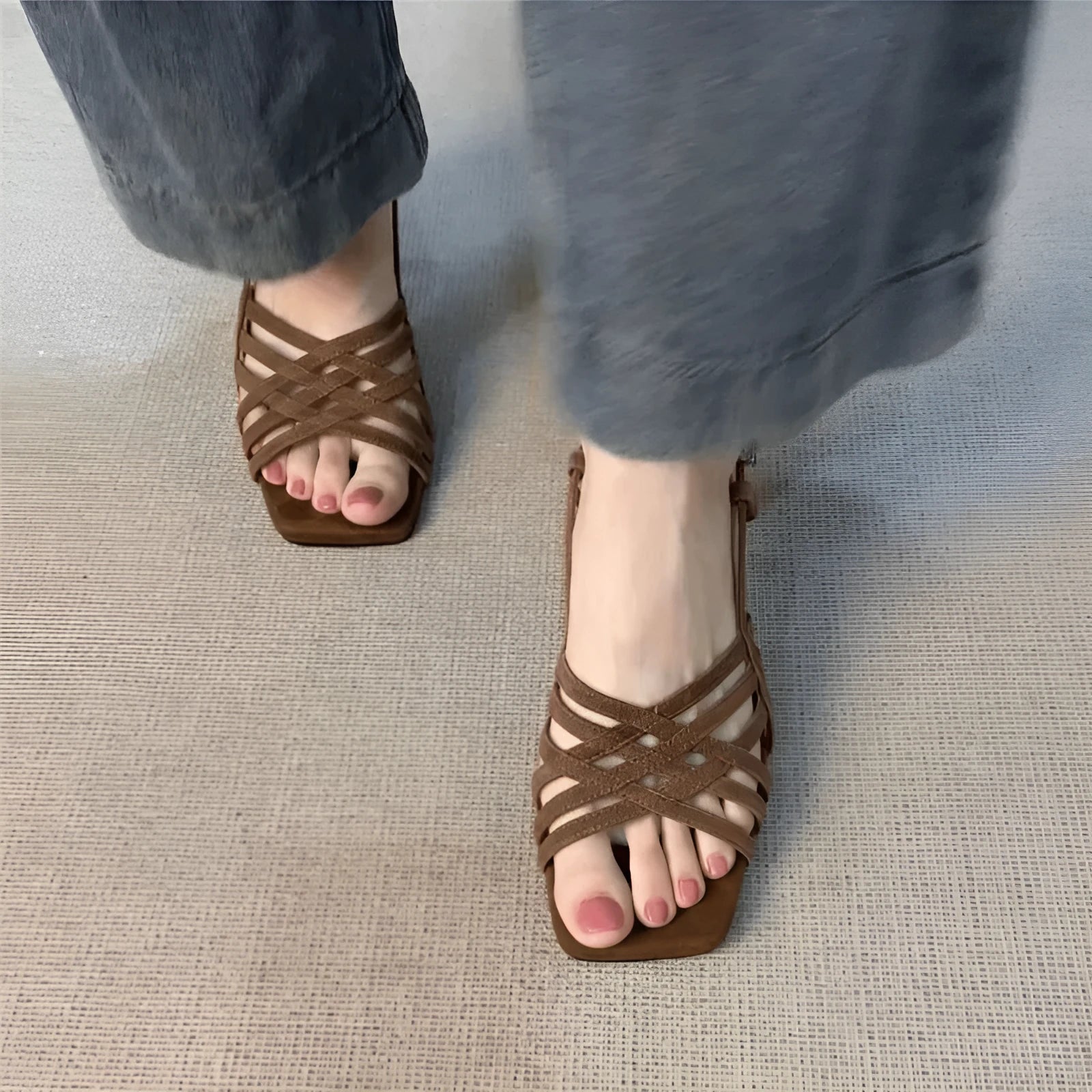Women's light brown retro sandals with thin cross ankle straps and a square toe on a mid-height heel.