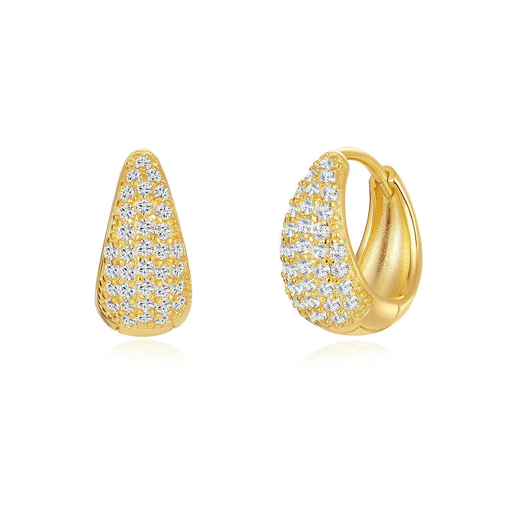 Golden brass earclip earrings with geometric shapes and round elements
