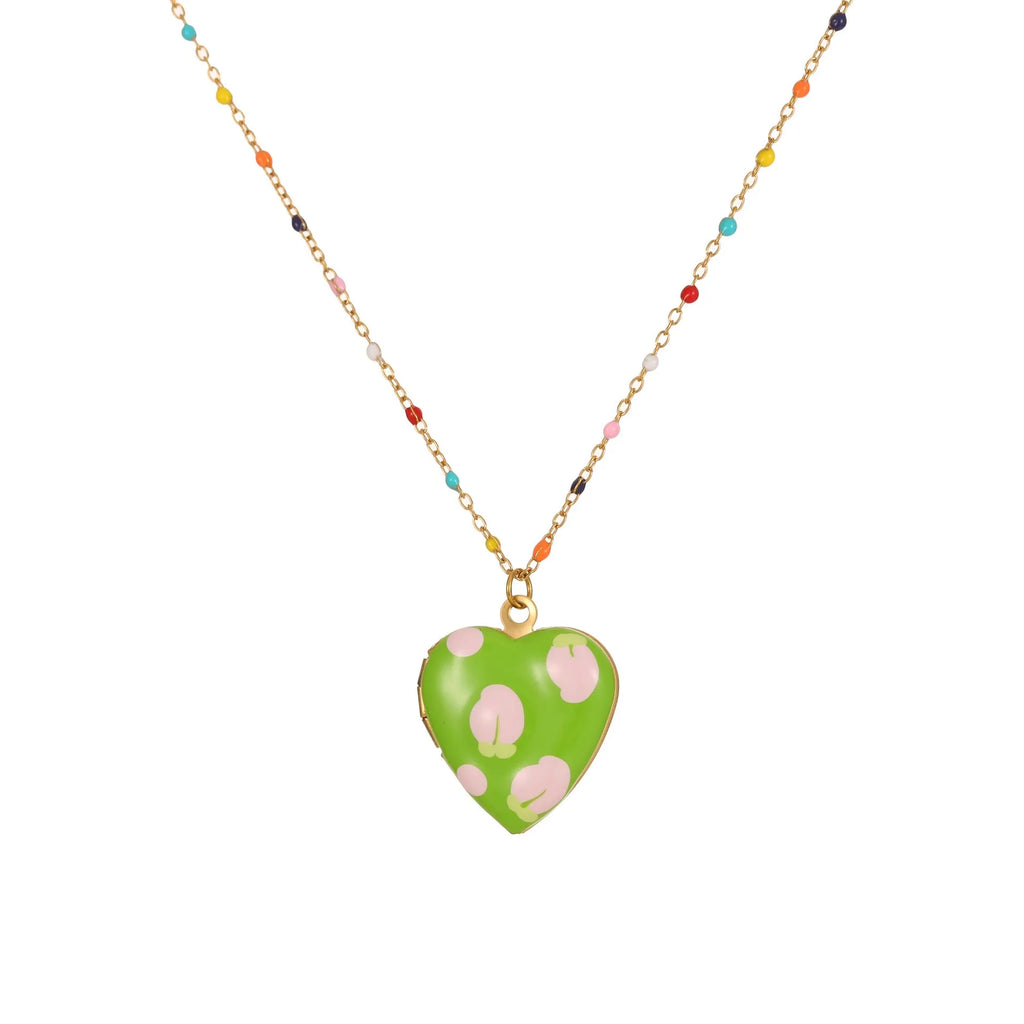 Gold-plated stainless steel necklace with heart-shaped fruit pendant on an adjustable chain.