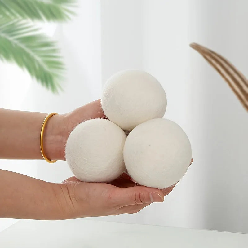 Set of six wool drying balls in three sizes 5cm 7cm 8cm for static reduction and chemical-free fabric softening