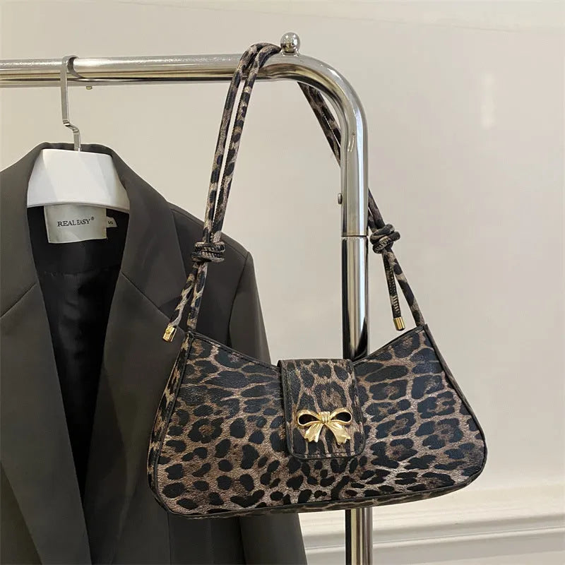 Women's casual handbag in black PU leather with sandwich pocket design measuring 27x13.5x6cm