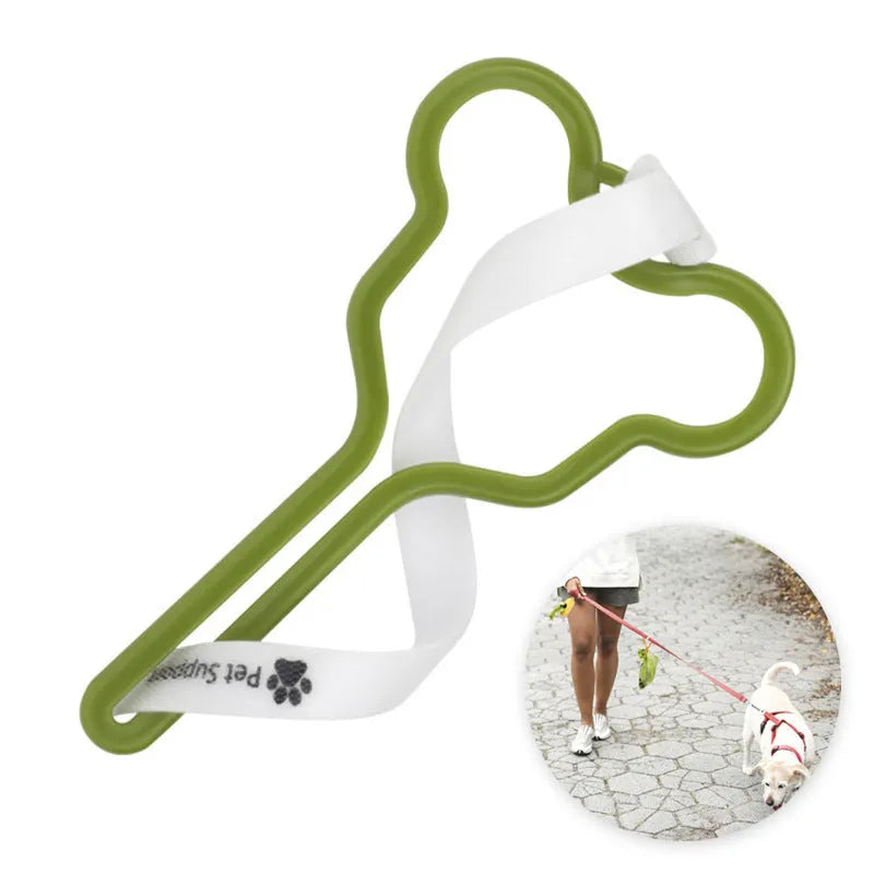 A coloured hands-free dog poop bag holder with a fixed clip and velcro strap attached to a dog leash.